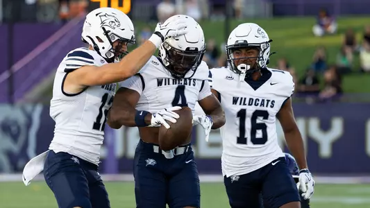 UNH defense celebrates an interception by Darren Burton II at UAlbany (8-28-26)