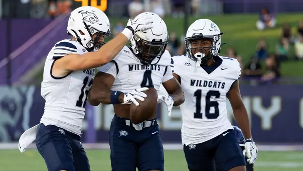 UNH defense celebrates an interception by Darren Burton II at UAlbany (8-28-26)
