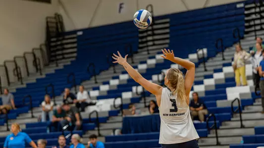 Dylan Hunt serves the ball.
