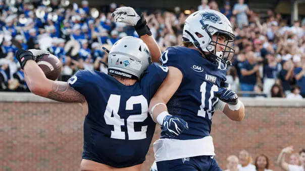 Trevor Barry and Cohen Cook celebrate Trevor's TD return of a blocked field goal vs. Stonehill