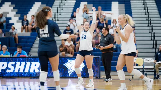 Jessica Shattles celebrates during a UNH volleyball match.