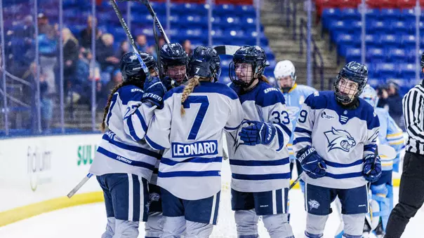 Women's hockey celebrates a win.