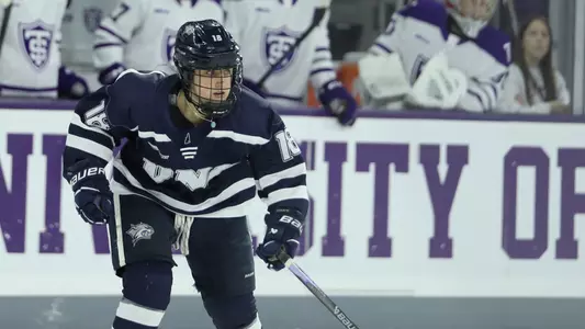Courtney Lilley skates to the puck.