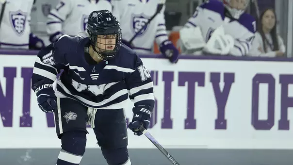 Courtney Lilley skates to the puck.