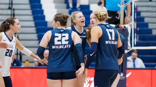 UNH volleyball celebrates a win.