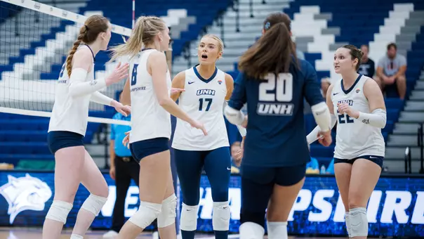 Volleyball team celebrates a point.