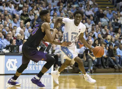 North Carolina's Brandon Robinson (14) handles the ball as Northern Iowa's Isaiah Brown (24) defends during the first half of an NCAA college basketball game in Chapel Hill, N.C., Wednesday, Dec. 21, 2016. (AP Photo/Ben McKeown)