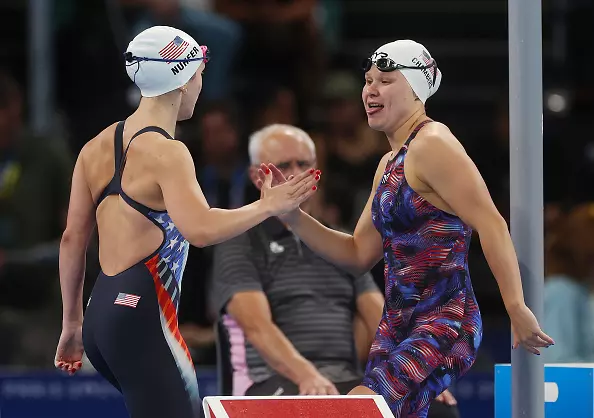 NANTERRE, FRANCE - AUGUST 29: Grace Nuhfer and Olivia Chambers of Team United States interact prior to the heats of the Women's 100m Butterfly on day one of the Paris 2024 Summer Paralympic Games at Paris La Defense Arena on August 29, 2024 in Nanterre, France. (Photo by Ian MacNicol/Getty Images)