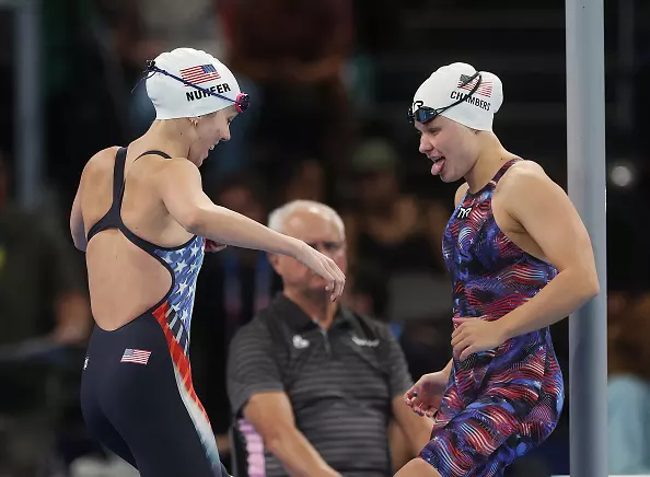 NANTERRE, FRANCE - AUGUST 29: Grace Nuhfer and Olivia Chambers of Team United States interact prior to the heats of the Women's 100m Butterfly on day one of the Paris 2024 Summer Paralympic Games at Paris La Defense Arena on August 29, 2024 in Nanterre, France. (Photo by Ian MacNicol/Getty Images)