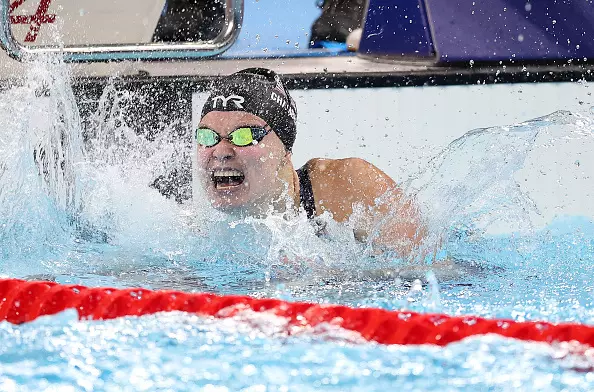 NANTERRE, FRANCE - AUGUST 31: Olivia Chambers of Team United States celebrates winning the gold medal after competing in the Women's 400m Freestyle - S13 Final on day three of the Paris 2024 Summer Paralympic Games at Paris La Defense Arena on August 31, 2024 in Nanterre, France. (Photo by Alex Davidson/Getty Images)