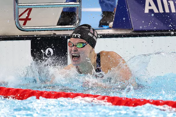 NANTERRE, FRANCE - AUGUST 31: Olivia Chambers of Team United States celebrates winning the gold medal after competing in the Women's 400m Freestyle - S13 Final on day three of the Paris 2024 Summer Paralympic Games at Paris La Defense Arena on August 31, 2024 in Nanterre, France. (Photo by Alex Davidson/Getty Images)