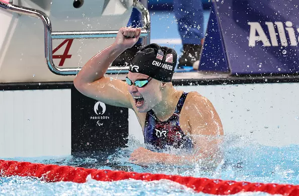 NANTERRE, FRANCE - AUGUST 31: Olivia Chambers of Team United States celebrates winning the gold medal after competing in the Women's 400m Freestyle - S13 Final on day three of the Paris 2024 Summer Paralympic Games at Paris La Defense Arena on August 31, 2024 in Nanterre, France. (Photo by Alex Davidson/Getty Images)