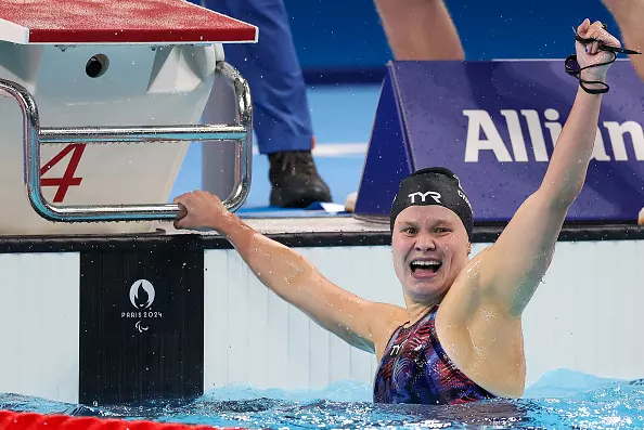 NANTERRE, FRANCE - AUGUST 31: Olivia Chambers of Team United States celebrates winning the gold medal after competing in the Women's 400m Freestyle - S13 Final on day three of the Paris 2024 Summer Paralympic Games at Paris La Defense Arena on August 31, 2024 in Nanterre, France. (Photo by Alex Davidson/Getty Images)