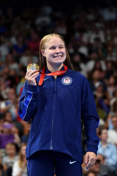 NANTERRE, FRANCE - AUGUST 31: Gold medalist Olivia Chambers of Team United States celebrates on the podium at the Para Swimming Women's 400m Freestyle - S13 Medal Ceremony on day three of the Paris 2024 Summer Paralympic Games at Paris La Defense Arena on August 31, 2024 in Nanterre, France. (Photo by Alex Davidson/Getty Images)