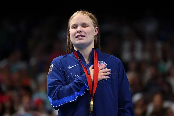 NANTERRE, FRANCE - AUGUST 31: Gold medalist Olivia Chambers of Team United States stands on the podium at the Para Swimming Women's 400m Freestyle - S13 Medal Ceremony on day three of the Paris 2024 Summer Paralympic Games at Paris La Defense Arena on August 31, 2024 in Nanterre, France. (Photo by Alex Davidson/Getty Images)
