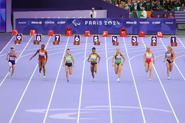 PARIS, FRANCE - SEPTEMBER 03: (L-R) Kym Crosby of Team United States, Bianca Borgella of Team Canada, Lamiya Valiyeva of Team Azerbaijan, Rayane Soares da Silva of Team Brazil, Orla Comerford of Team Ireland, Adiaratou Iglesias Forneiro of Team Spain and Erin Kerkhoff of Team United States compete during the Women's 100m T13 Final on day six of the Paris 2024 Summer Paralympic Games at Stade de France on September 03, 2024 in Paris, France. (Photo by Alex Davidson/Getty Images)