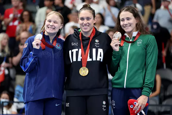 NANTERRE, FRANCE - SEPTEMBER 03: Gold medalist Carlotta Gilli of Team Italy (C), Silver medalist Olivia Chambers of Team United States (L) and Bronze medalist Roisin Ni Riain of Team Ireland (R) pose for a photo during the Para Swimming Women's 200m Individual Medley SM13 Medal Ceremony on day six of the Paris 2024 Summer Paralympic Games at Paris La Defense Arena on September 03, 2024 in Nanterre, France. (Photo by Sean M. Haffey/Getty Images)