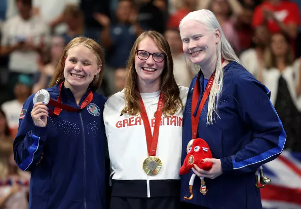 NANTERRE, FRANCE - SEPTEMBER 05: Gold medalist Rebecca Redfern of Team Great Britain (C), Silver medalist Olivia Chambers of Team United States (L) and Bronze medalist Colleen Young of Team United States (R) pose for a photo during the medal ceremony of the Women's 100m Breaststroke - SB13 Final on day eight of the Paris 2024 Summer Paralympic Games at Paris La Defense Arena on September 05, 2024 in Nanterre, France. (Photo by Sean M. Haffey/Getty Images)