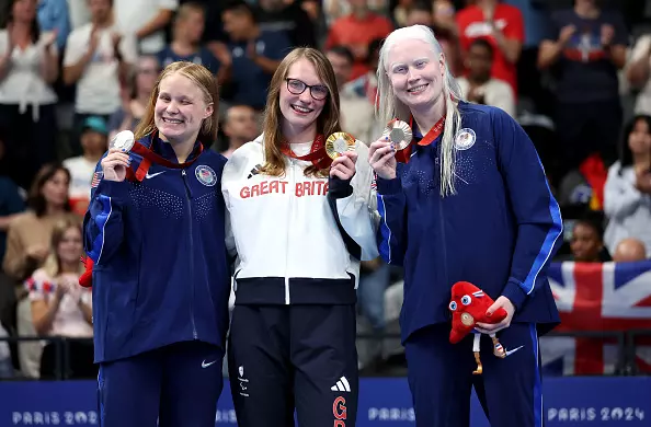 NANTERRE, FRANCE - SEPTEMBER 05: Gold medalist Rebecca Redfern of Team Great Britain (C), Silver medalist Olivia Chambers of Team United States (L) and Bronze medalist Colleen Young of Team United States (R) pose for a photo during the medal ceremony of the Women's 100m Breaststroke - SB13 Final on day eight of the Paris 2024 Summer Paralympic Games at Paris La Defense Arena on September 05, 2024 in Nanterre, France. (Photo by Sean M. Haffey/Getty Images)