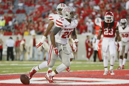 Running back Keith Whitely celebrates after scoring a touchdown in the first half.