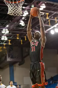 Goodluck Okonoboh elevates for a dunk on a fast break.