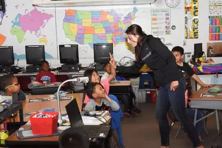 UNLV softball head coach Lisa Dodd interacting with Hoggard Elementary first graders.