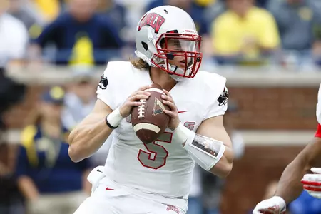Quarterback Blake Decker looks to pass against Michigan