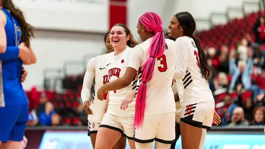 Lady Rebels smile