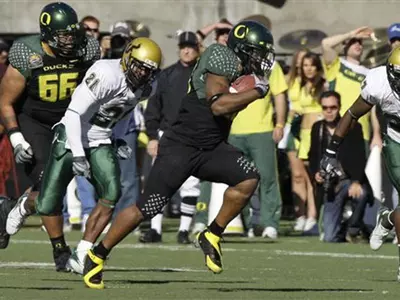 Jonathan Stewart breaks away for a 71-yard touchdown run in the Brut Sun Bowl