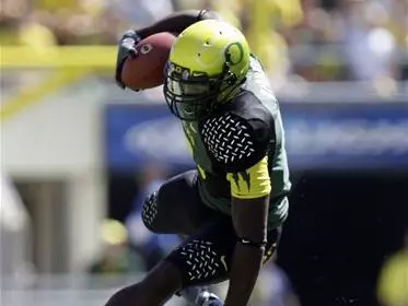 LeGarrette jumping over Utah State Defender