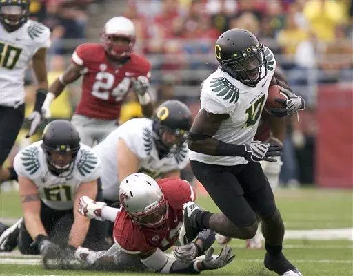 Oregon wide receiver D. J. Davis, right,