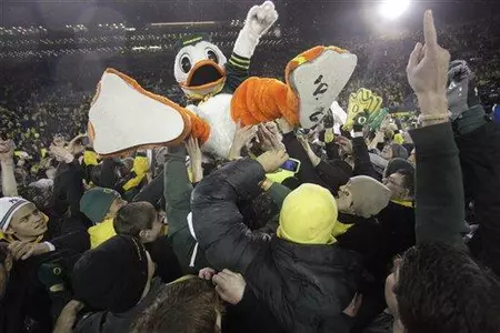 The Oregon duck celebrate with fans after Oregon defeated Arizona