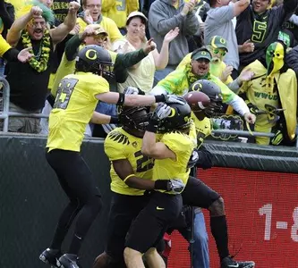 Boseko Lokombo (25) celebrates after carrying a blocked punt for a touchdown