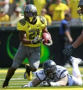 LaMichael James (21) pulls away vs. Nevada