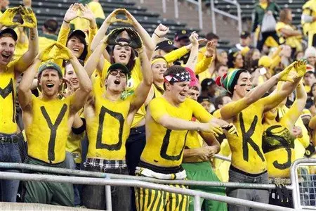 Oregon fans cheer as the Ducks take the field
