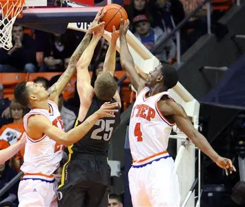 Oregon's E.J. Singler (25) is stopped at