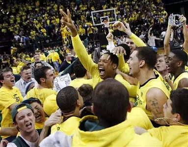 Oregon players celebrate with fans