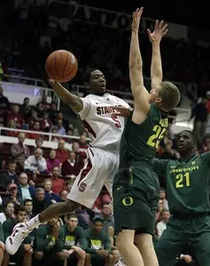 Stanford's Chasson Randle, left, looks