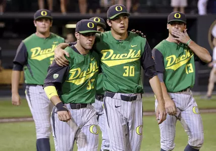 A.J. Balta (33) and starting pitcher Stephen Nogosek (30) leave the field