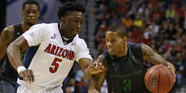 Oregon's Joseph Young (3) drives against