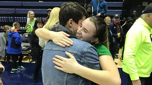 Sabrina Ionescu hugs her twin brother Eddy after her buzzer beater to beat California 2016-17