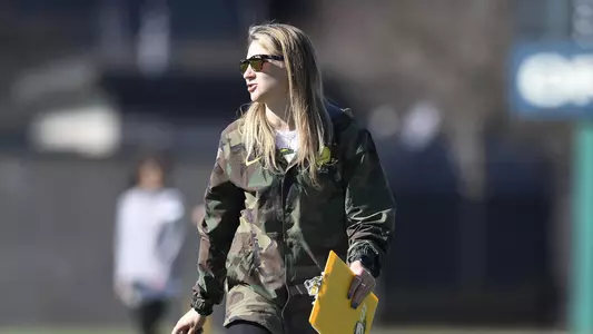 Coach Caitlin Prince coaching from the sideline