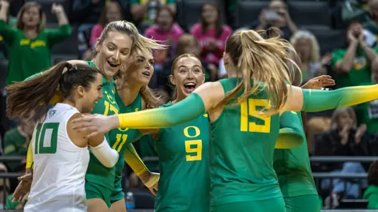 Team huddle celebration vs Cal