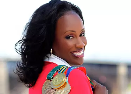 Jackie Joyner-Kersee poses for a photo with her Olympic medals
