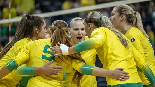 Team huddle celebration vs UW - Sept. 29