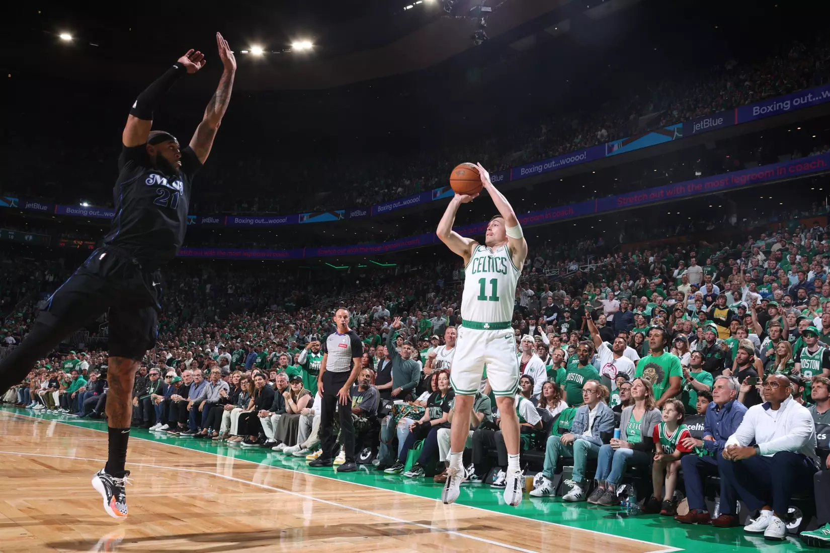 BOSTON, MA - JUNE 6: Payton Pritchard #11 of the Boston Celtics shoots a three point basket against the Dallas Mavericks during Game 1 of the 2024 NBA Finals on June 6, 2024 at the TD Garden in Boston, Massachusetts. NOTE TO USER: User expressly acknowledges and agrees that, by downloading and or using this photograph, User is consenting to the terms and conditions of the Getty Images License Agreement. Mandatory Copyright Notice: Copyright 2024 NBAE  (Photo by Nathaniel S. Butler/NBAE via Getty Images)