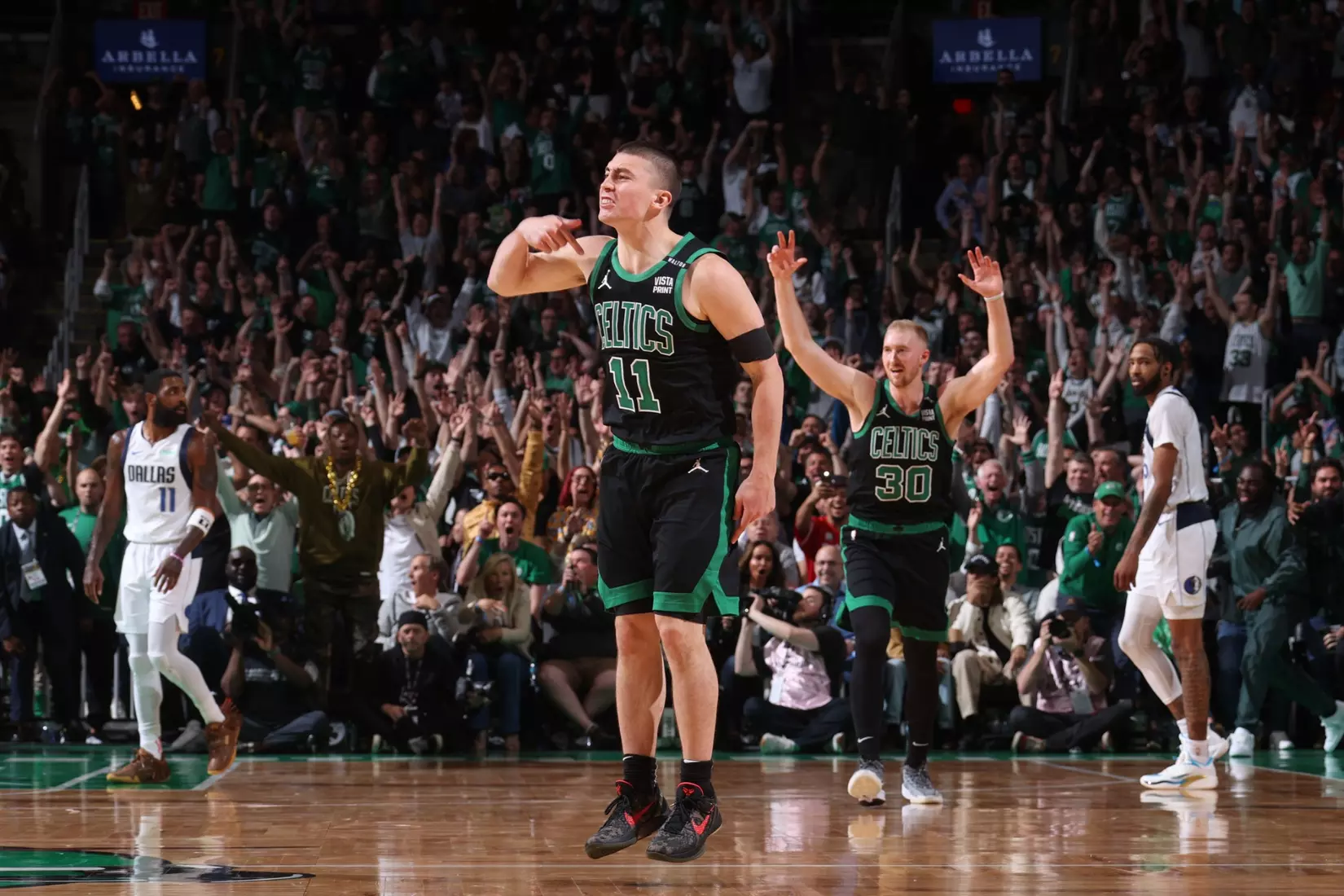 BOSTON, MA - JUNE 9: Payton Pritchard #11 of the Boston Celtics celebrates during the game against the Dallas Mavericks during Game 1 of the 2024 NBA Finals on June 9, 2024 at the TD Garden in Boston, Massachusetts. NOTE TO USER: User expressly acknowledges and agrees that, by downloading and or using this photograph, User is consenting to the terms and conditions of the Getty Images License Agreement. Mandatory Copyright Notice: Copyright 2024 NBAE  (Photo by Nathaniel S. Butler/NBAE via Getty Images)