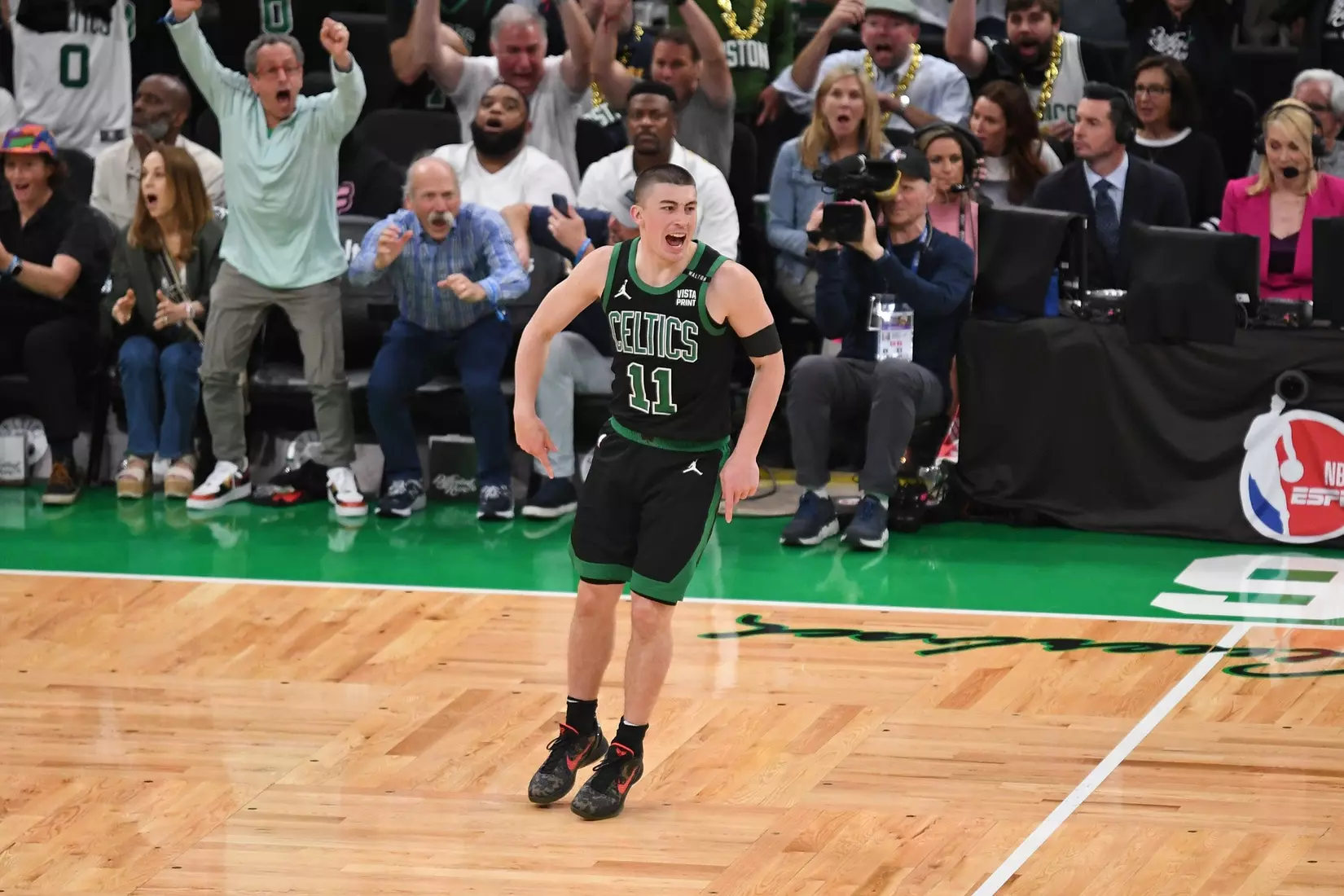 BOSTON, MA - JUNE 9: Payton Pritchard #11 of the Boston Celtics celebrates three point basket during the game against the Dallas Mavericks during Game 2 of the 2024 NBA Finals on June 9, 2024 at the TD Garden in Boston, Massachusetts. NOTE TO USER: User expressly acknowledges and agrees that, by downloading and or using this photograph, User is consenting to the terms and conditions of the Getty Images License Agreement. Mandatory Copyright Notice: Copyright 2024 NBAE  (Photo by China Wong/NBAE via Getty Images)