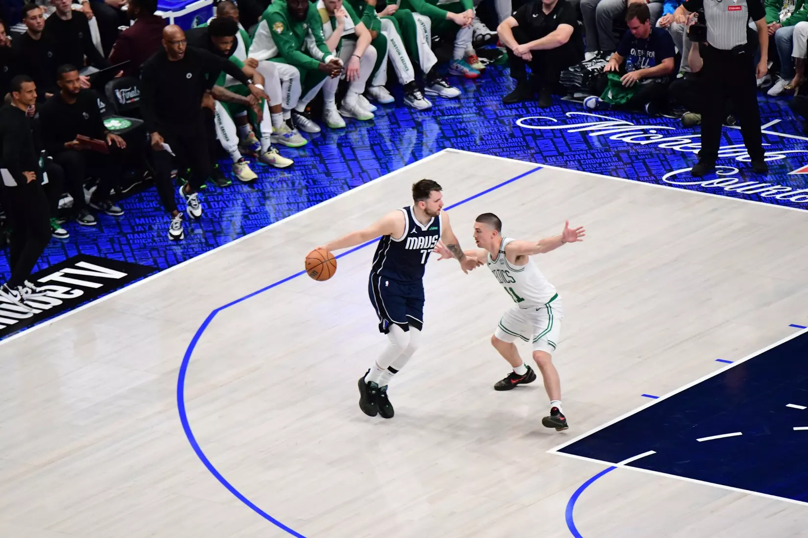 BOSTON, MA - JUNE 12:  Payton Pritchard #11 of the Boston Celtics plays defense during the game  against Luka Doncic #77 of the Dallas Mavericks during Game Three of the 2024 NBA Finals on June 12, 2024 at the American Airlines Center in Dallas, Texas. NOTE TO USER: User expressly acknowledges and agrees that, by downloading and or using this photograph, User is consenting to the terms and conditions of the Getty Images License Agreement. Mandatory Copyright Notice: Copyright 2024 NBAE (Photo by Adam Pantozzi/NBAE via Getty Images)