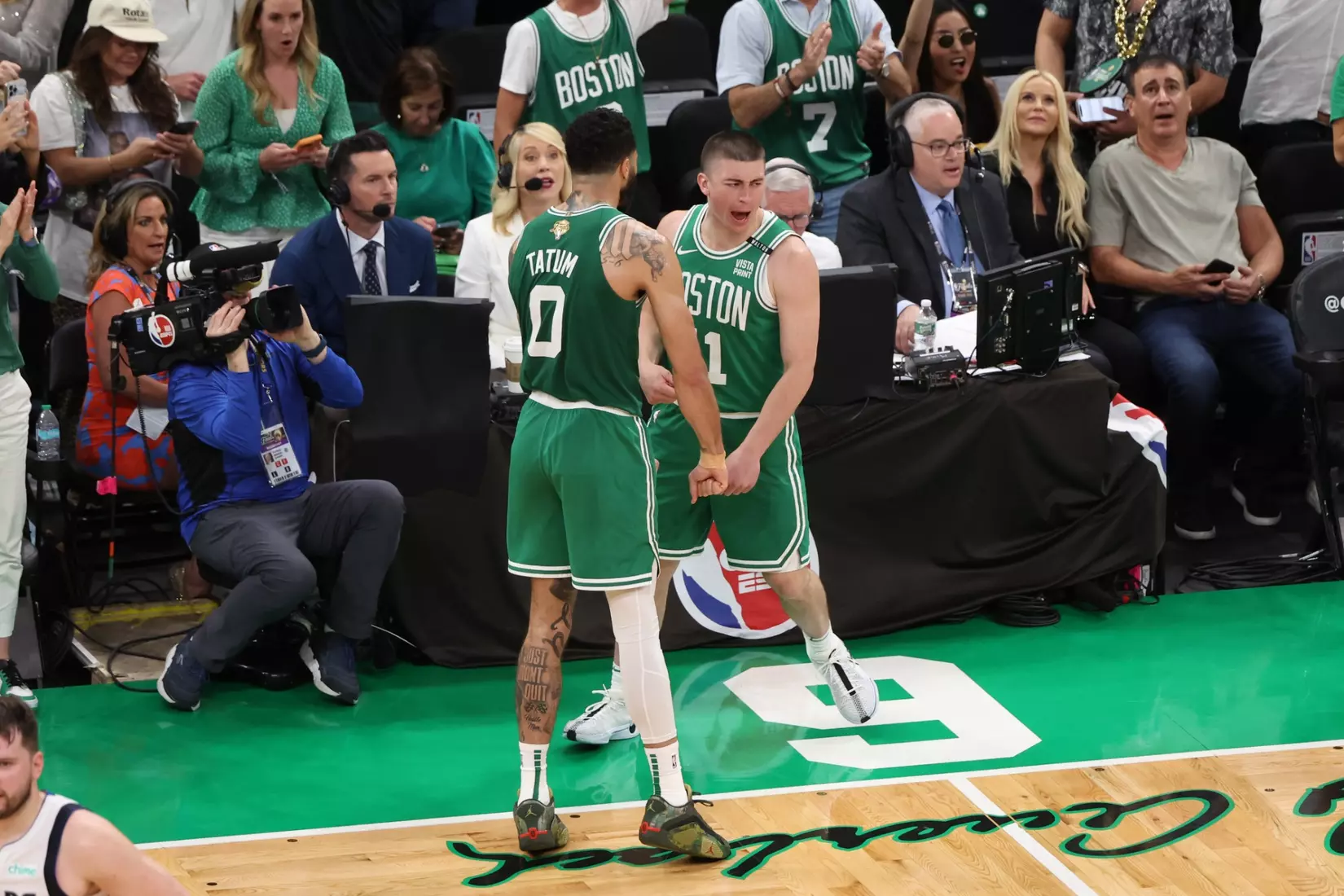 BOSTON, MA - JUNE 17: Jayson Tatum #0 and Payton Pritchard #11 of the Boston Celtics celebrates during the game against the Dallas Mavericks during Game 5 of the 2024 NBA Finals on June 17, 2024 at TD Garden in Boston, Massachusetts. NOTE TO USER: User expressly acknowledges and agrees that, by downloading and or using this photograph, User is consenting to the terms and conditions of the Getty Images License Agreement. Mandatory Copyright Notice: Copyright 2024 NBAE  (Photo by Joe Murphy/NBAE via Getty Images)